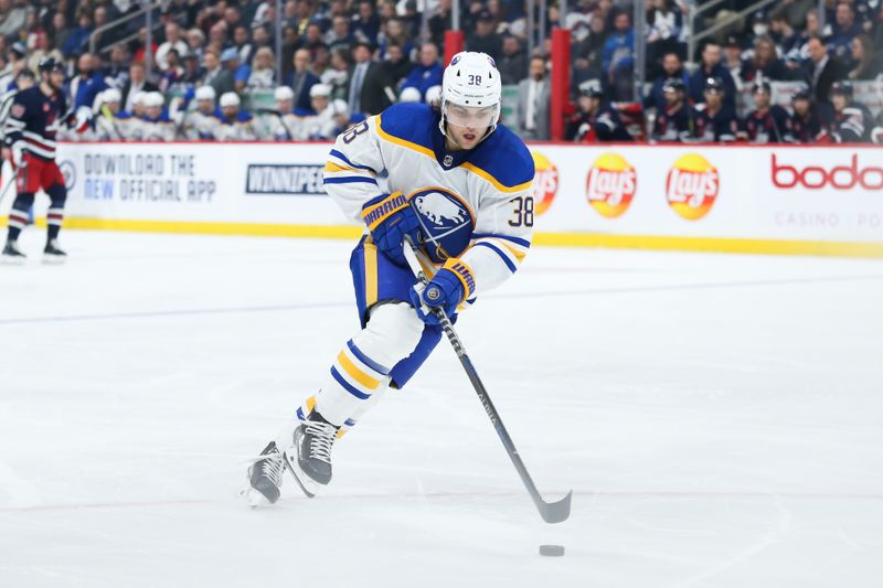 Jan 26, 2023; Winnipeg, Manitoba, CAN;  Buffalo Sabres defenseman Kale Clague (38) skates into the Winnipeg Jets zone during the second period at Canada Life Centre. Mandatory Credit: Terrence Lee-USA TODAY Sports