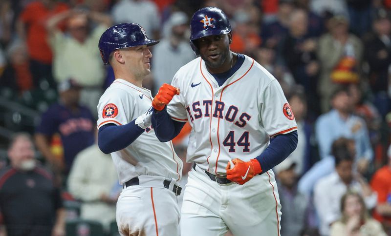 Apr 3, 2024; Houston, Texas, USA; Houston Astros left fielder Yordan Alvarez (44) celebrates with third baseman Alex Bregman (2) after hitting a home run during the sixth inning against the Toronto Blue Jays at Minute Maid Park. Mandatory Credit: Troy Taormina-USA TODAY Sports