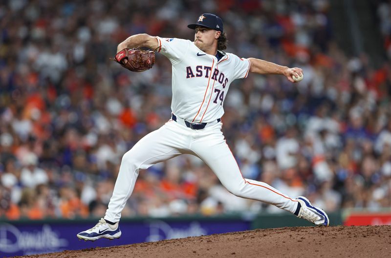 Jul 27, 2024; Houston, Texas, USA; Houston Astros relief pitcher Bryan King (74) delivers a pitch during the fifth inning against the Los Angeles Dodgers at Minute Maid Park. Mandatory Credit: Troy Taormina-USA TODAY Sports