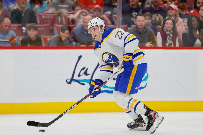 Apr 4, 2023; Sunrise, Florida, USA; Buffalo Sabres right wing Jack Quinn (22) moves the puck during the first period against the Florida Panthers at FLA Live Arena. Mandatory Credit: Sam Navarro-USA TODAY Sports