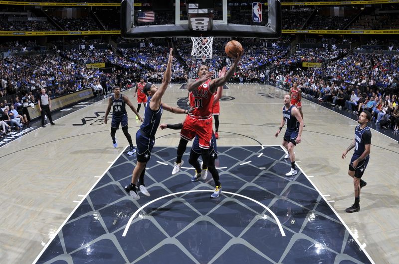 ORLANDO, FL - APRIL 7: DeMar DeRozan #11 of the Chicago Bulls drives to the basket during the game against the Orlando Magic on April 7, 2024 at the Kia Center in Orlando, Florida. NOTE TO USER: User expressly acknowledges and agrees that, by downloading and or using this photograph, User is consenting to the terms and conditions of the Getty Images License Agreement. Mandatory Copyright Notice: Copyright 2024 NBAE (Photo by Fernando Medina/NBAE via Getty Images)