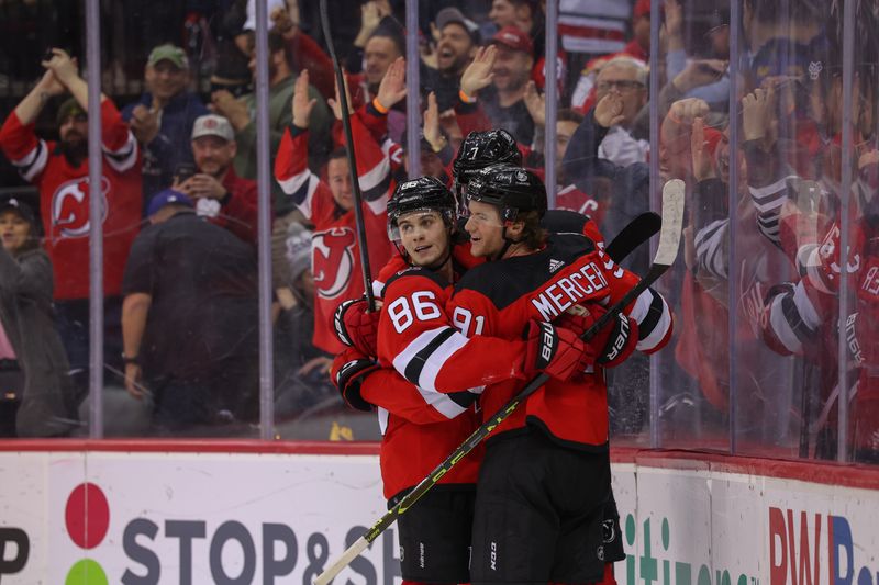 Feb 23, 2023; Newark, New Jersey, USA; New Jersey Devils center Dawson Mercer (91) celebrates his game winning goal against the Los Angeles Kings during overtime at Prudential Center. Mandatory Credit: Ed Mulholland-USA TODAY Sports