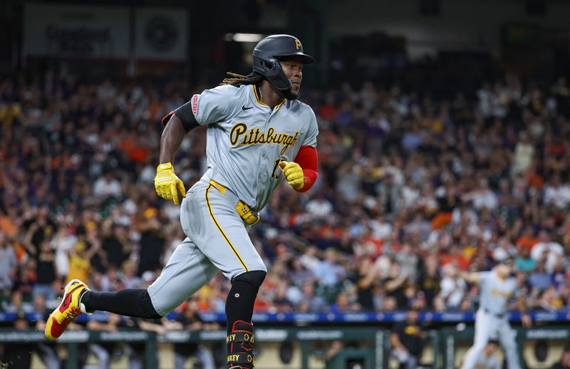 Jul 29, 2024; Houston, Texas, USA; Pittsburgh Pirates shortstop Oneil Cruz (15) runs to first base on an RBI double during the eighth inning against the Houston Astros at Minute Maid Park. Mandatory Credit: Troy Taormina-USA TODAY Sports