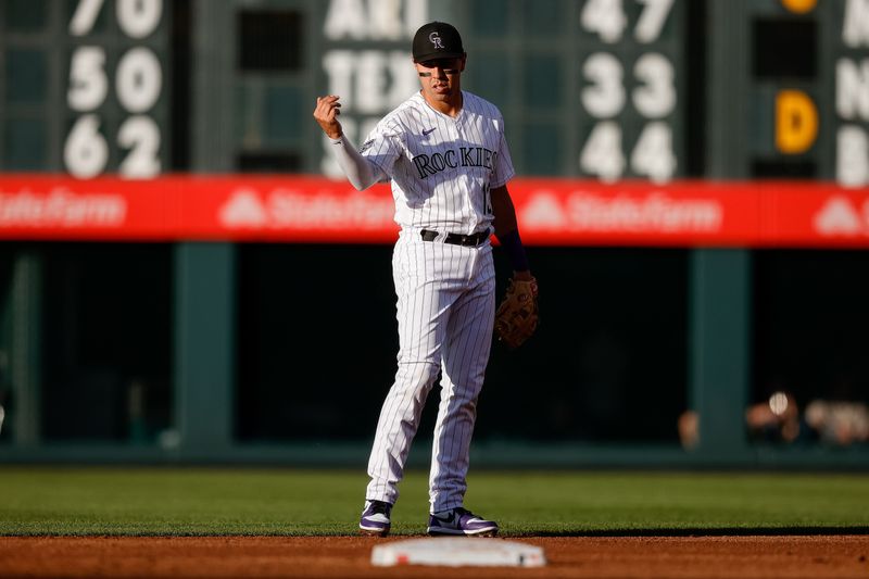 Jul 28, 2023; Denver, Colorado, USA; Colorado Rockies second baseman Alan Trejo (13) gestures in the second inning against the Oakland Athletics at Coors Field. Mandatory Credit: Isaiah J. Downing-USA TODAY Sports