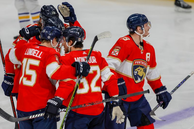 Apr 4, 2023; Sunrise, Florida, USA; Florida Panthers left wing Matthew Tkachuk (19) celebrates with teammates after scoring during the third period against the Buffalo Sabres at FLA Live Arena. Mandatory Credit: Sam Navarro-USA TODAY Sports