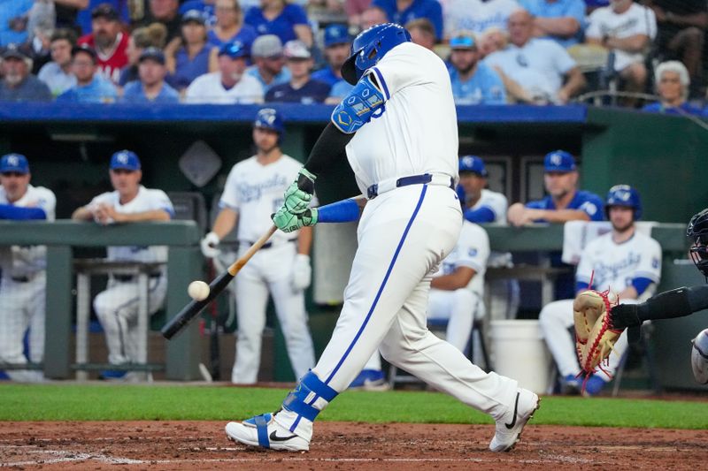 Sep 4, 2024; Kansas City, Missouri, USA; Kansas City Royals first baseman Salvador Perez (13) connects for a double against the Cleveland Guardians in the third inning at Kauffman Stadium. Mandatory Credit: Denny Medley-Imagn Images