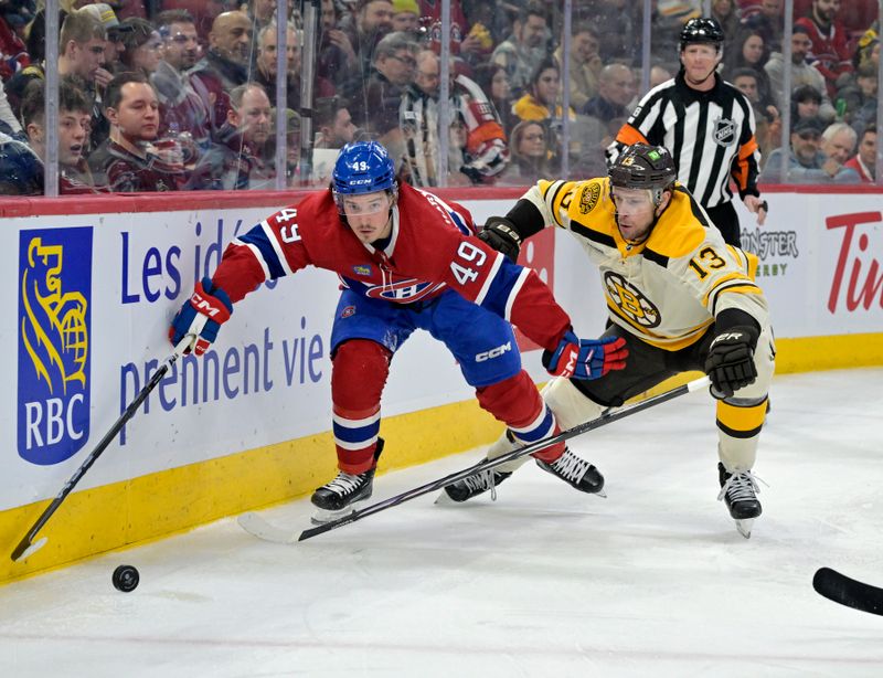 Mar 14, 2024; Montreal, Quebec, CAN; Montreal Canadiens forward Rafael Harvey-Pinard (49) and Boston Bruins forward Charlie Coyle (13) battle for the puck during the second period at the Bell Centre. Mandatory Credit: Eric Bolte-USA TODAY Sports