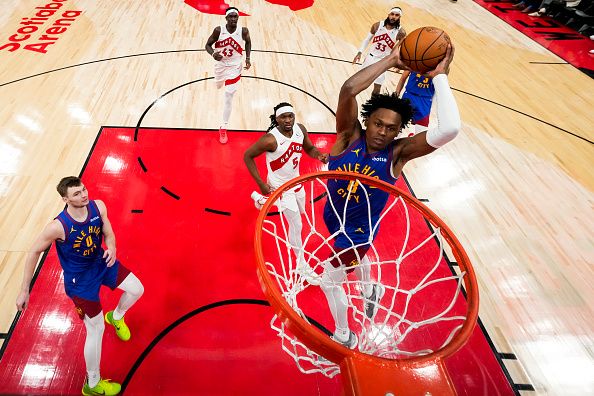 TORONTO, ON - DECEMBER 20: Peyton Watson #8 of the Denver Nuggets goes to the basket against the Toronto Raptors during the second half at Scotiabank Arena on December 20, 2023 in Toronto, Ontario, Canada. NOTE TO USER: User expressly acknowledges and agrees that, by downloading and/or using this Photograph, user is consenting to the terms and conditions of the Getty Images License Agreement. (Photo by Andrew Lahodynskyj/Getty Images)