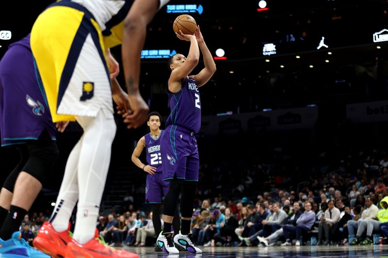 CHARLOTTE, NORTH CAROLINA - FEBRUARY 12: Grant Williams #2 of the Charlotte Hornets shoots a free throw during the first half of an NBA game against the Indiana Pacers at Spectrum Center on February 12, 2024 in Charlotte, North Carolina. NOTE TO USER: User expressly acknowledges and agrees that, by downloading and or using this photograph, User is consenting to the terms and conditions of the Getty Images License Agreement. (Photo by David Jensen/Getty Images)