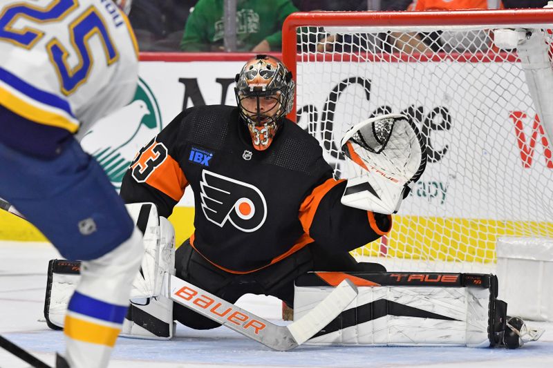 Mar 4, 2024; Philadelphia, Pennsylvania, USA; Philadelphia Flyers goaltender Samuel Ersson (33) covers the get against the St. Louis Blues during the first period at Wells Fargo Center. Mandatory Credit: Eric Hartline-USA TODAY Sports