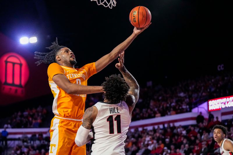 Jan 13, 2024; Athens, Georgia, USA; Tennessee Volunteers forward Jonas Aidoo (0) drives to the basket against Tennessee Volunteers forward Tobe Awaka (11) during the first half at Stegeman Coliseum. Mandatory Credit: Dale Zanine-USA TODAY Sports