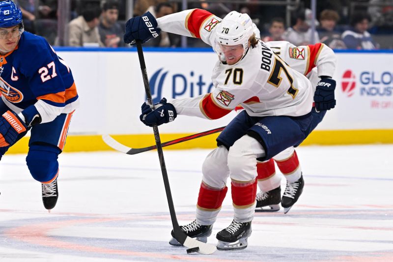 Oct 26, 2024; Elmont, New York, USA;  Florida Panthers center Jesper Boqvist (70) skates with the puck against the New York Islanders during the third period at UBS Arena. Mandatory Credit: Dennis Schneidler-Imagn Images