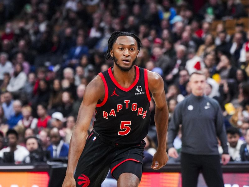 TORONTO, ON - FEBRUARY 9: Immanuel Quickley #5 of the Toronto Raptors dribbles against the Houston Rockets during the first half of their basketball game at the Scotiabank Arena on February 9, 2024 in Toronto, Ontario, Canada. NOTE TO USER: User expressly acknowledges and agrees that, by downloading and/or using this Photograph, user is consenting to the terms and conditions of the Getty Images License Agreement. (Photo by Mark Blinch/Getty Images)