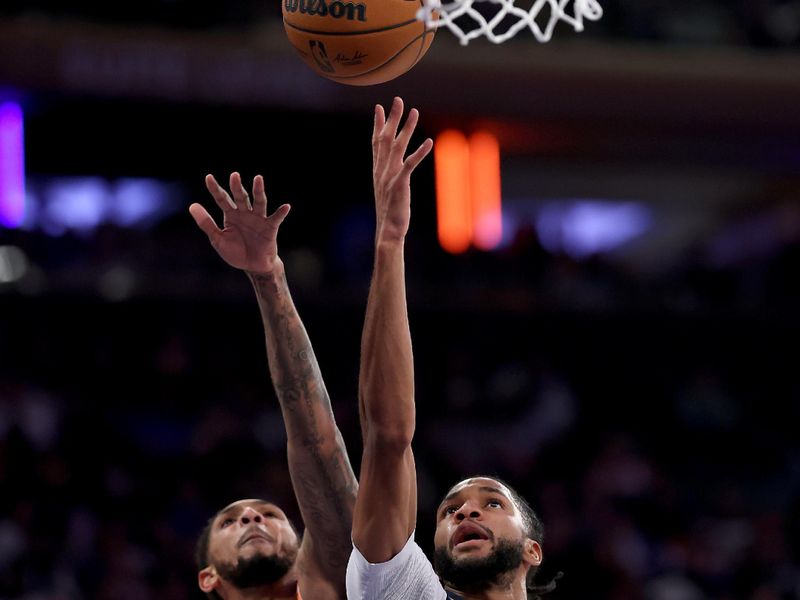 NEW YORK, NEW YORK - JANUARY 10:  Isaiah Joe #11 of the Oklahoma City Thunder heads for the net as Cameron Payne #1 of the New York Knicks defends during the first half at Madison Square Garden on January 10, 2025 in New York City. NOTE TO USER: User expressly acknowledges and agrees that, by downloading and or using this photograph, User is consenting to the terms and conditions of the Getty Images License Agreement. (Photo by Elsa/Getty Images)