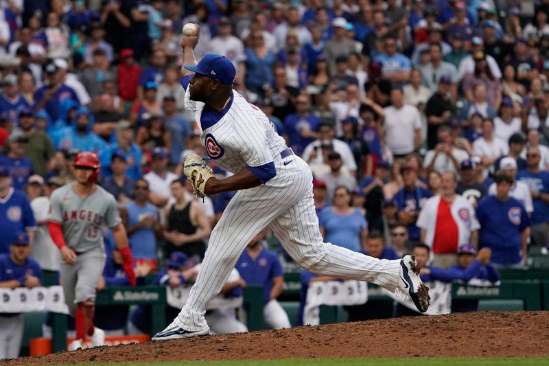 Jul 7, 2024; Chicago, Illinois, USA; Chicago Cubs pitcher Héctor Neris (51) throws the ball against the Los Angeles Angels during the ninth inning at Wrigley Field. Mandatory Credit: David Banks-USA TODAY Sports