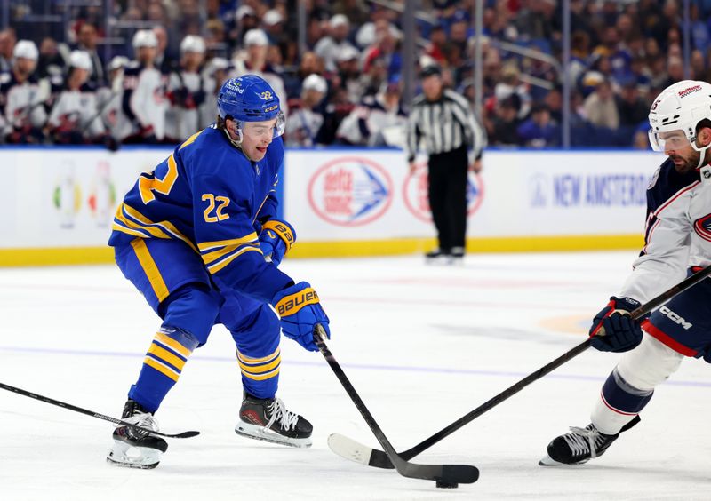 Oct 28, 2025; Buffalo, New York, USA;  Buffalo Sabres right wing Jack Quinn (22) makes a pass during the second period against the Columbus Blue Jackets at KeyBank Center. Mandatory Credit: Timothy T. Ludwig-Imagn Images