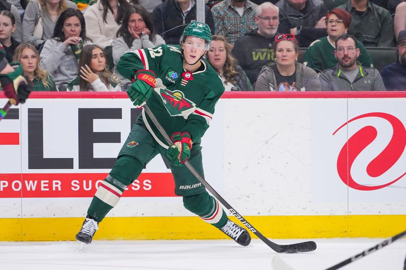 Mar 12, 2024; Saint Paul, Minnesota, USA; Minnesota Wild left wing Matt Boldy (12) passes against the Arizona Coyotes in the second period at Xcel Energy Center. Mandatory Credit: Brad Rempel-USA TODAY Sports