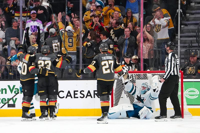 Nov 29, 2025; Las Vegas, Nevada, USA; San Jose Sharks goaltender Alex Nedeljkovic (33) protests as Vegas Golden Knights center Colton Sissons (10) celebrates with team mates after scoring a goal during the second period at T-Mobile Arena. Mandatory Credit: Stephen R. Sylvanie-Imagn Images