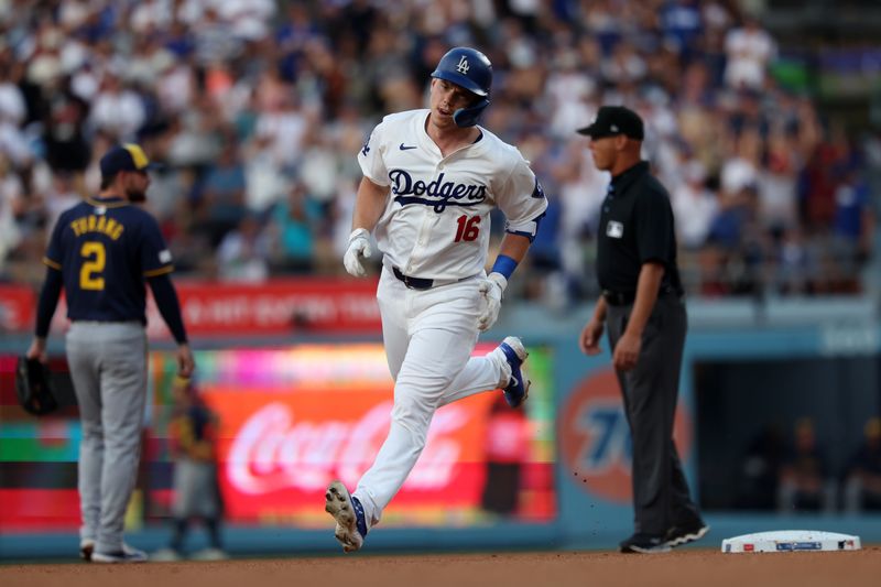 Jul 5, 2024; Los Angeles, California, USA;  Los Angeles Dodgers catcher Will Smith (16) runs around bases after hitting a solo home run during the third inning against the Milwaukee Brewers at Dodger Stadium. Mandatory Credit: Kiyoshi Mio-USA TODAY Sports