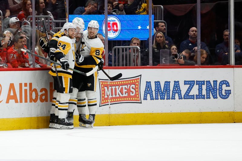 Nov 8, 2024; Washington, District of Columbia, USA; Pittsburgh Penguins center Evgeni Malkin (71) celebrates with teammates after scoring a goal against the Washington Capitals in the third period at Capital One Arena. Mandatory Credit: Geoff Burke-Imagn Images