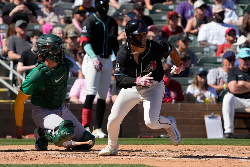 Mar 11, 2024; Salt River Pima-Maricopa, Arizona, USA; Arizona Diamondbacks center fielder Alek Thomas (5) hits against the Oakland Athletics in the second inning at Salt River Fields at Talking Stick. Mandatory Credit: Rick Scuteri-USA TODAY Sports