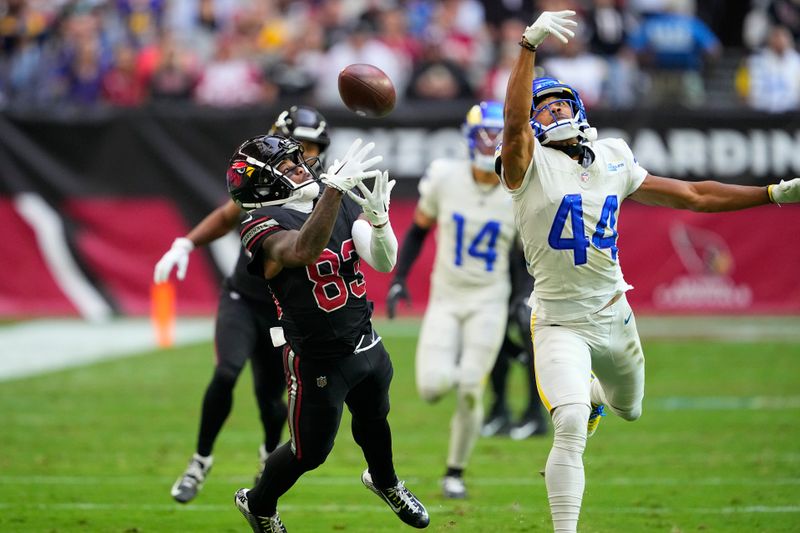 Los Angeles Rams cornerback Ahkello Witherspoon (44) breaks up a pass intended for Arizona Cardinals wide receiver Greg Dortch, left, during the first half of an NFL football game, Sunday, Nov. 26, 2023, in Glendale, Ariz. (AP Photo/Matt York)