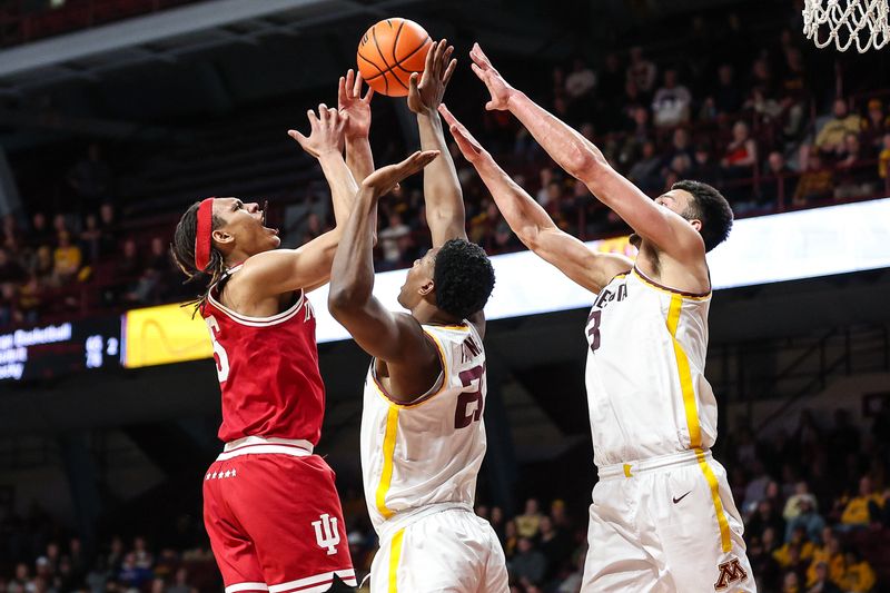 Mar 6, 2024; Minneapolis, Minnesota, USA; Indiana Hoosiers forward Malik Reneau (5), Minnesota Golden Gophers forward Pharrel Payne (21) and forward Dawson Garcia (3) jump for the ball during the second half at Williams Arena. Mandatory Credit: Matt Krohn-USA TODAY Sports