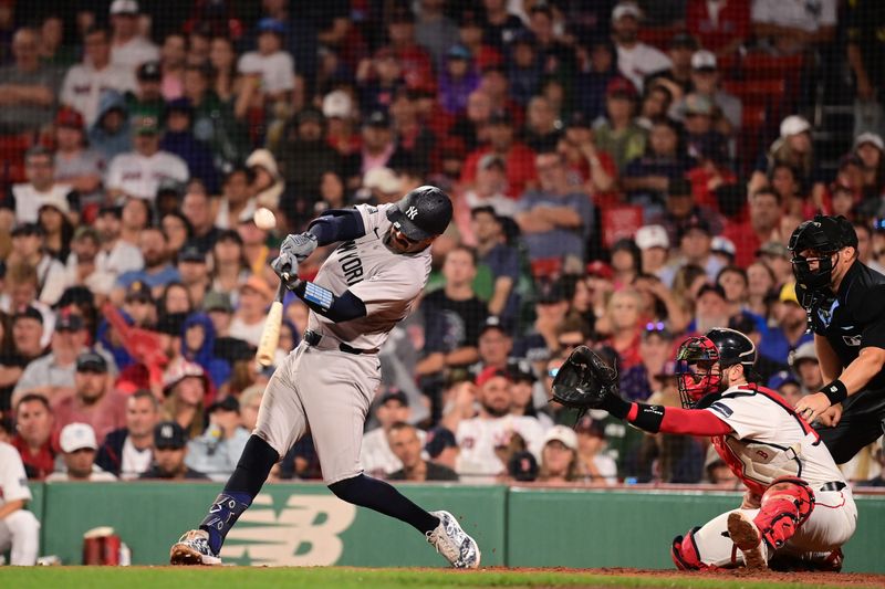 Jul 28, 2024; Boston, Massachusetts, USA; New York Yankees catcher Austin Wells (28) hits an RBI single against the Boston Red Sox during the seventh inning at Fenway Park. Mandatory Credit: Eric Canha-USA TODAY Sports