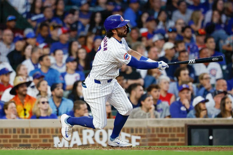 Sep 2, 2024; Chicago, Illinois, USA; Chicago Cubs shortstop Dansby Swanson (7) hits a solo home run against the Pittsburgh Pirates during the third inning at Wrigley Field. Mandatory Credit: Kamil Krzaczynski-USA TODAY Sports