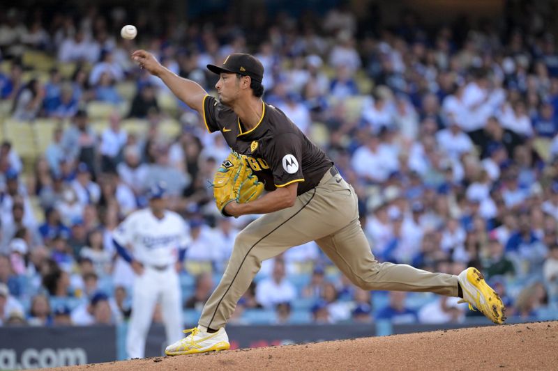 Oct 6, 2024; Los Angeles, California, USA; San Diego Padres pitcher Yu Darvish (11) pitches against the Los Angeles Dodgers in the first inning during game two of the NLDS for the 2024 MLB Playoffs at Dodger Stadium. Mandatory Credit: Jayne Kamin-Oncea-Imagn Images