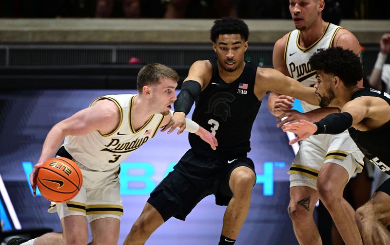 Mar 2, 2024; West Lafayette, Indiana, USA; Purdue Boilermakers guard Braden Smith (3) drives to get around Michigan State Spartans guard Jaden Akins (3) during the first half at Mackey Arena. Mandatory Credit: Marc Lebryk-USA TODAY Sports