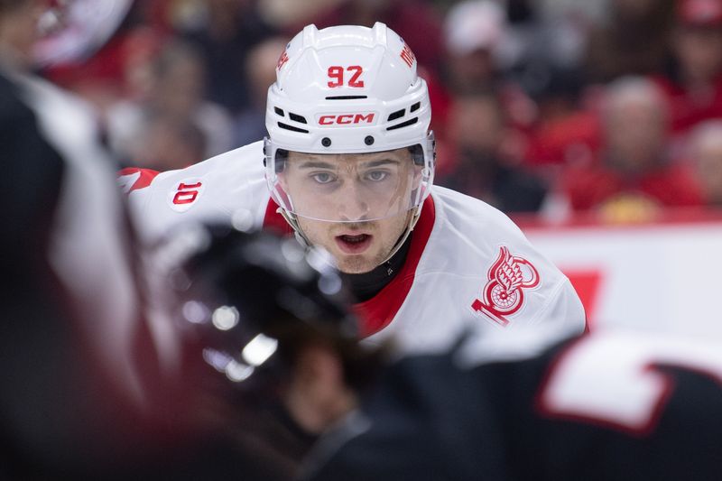 Jan 5, 2026; Ottawa, Ontario, CAN; Detroit Red Wings center Marco Kasper (92) gets in position for a faceoff in the second period against the Ottawa Senators at the Canadian Tire Centre. Mandatory Credit: Marc DesRosiers-IMAGN Images