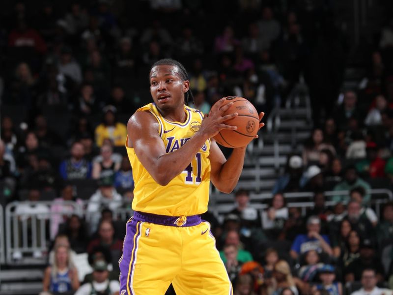 MILWAUKEE, WI - OCTOBER 10: Quincy Olivari #41 of the Los Angeles Lakers handles the ball during the game against the Milwaukee Bucks during a preseason game on October 10, 2024 at Fiserv Forum Center in Milwaukee, Wisconsin. NOTE TO USER: User expressly acknowledges and agrees that, by downloading and or using this Photograph, user is consenting to the terms and conditions of the Getty Images License Agreement. Mandatory Copyright Notice: Copyright 2024 NBAE (Photo by Gary Dineen/NBAE via Getty Images).