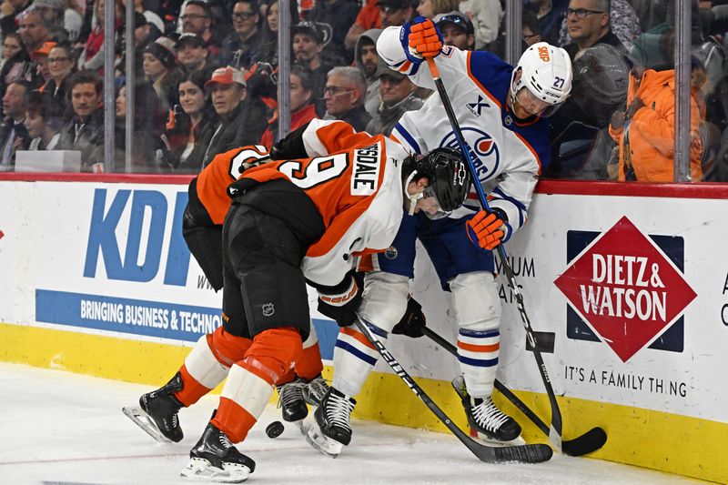 Nov 12, 2025; Philadelphia, Pennsylvania, USA; Philadelphia Flyers right wing Bobby Brink (10) and defenseman Jamie Drysdale (9) battle for the puck with Edmonton Oilers defenseman Brett Kulak (27) during the second period at Xfinity Mobile Arena. Mandatory Credit: Eric Hartline-Imagn Images