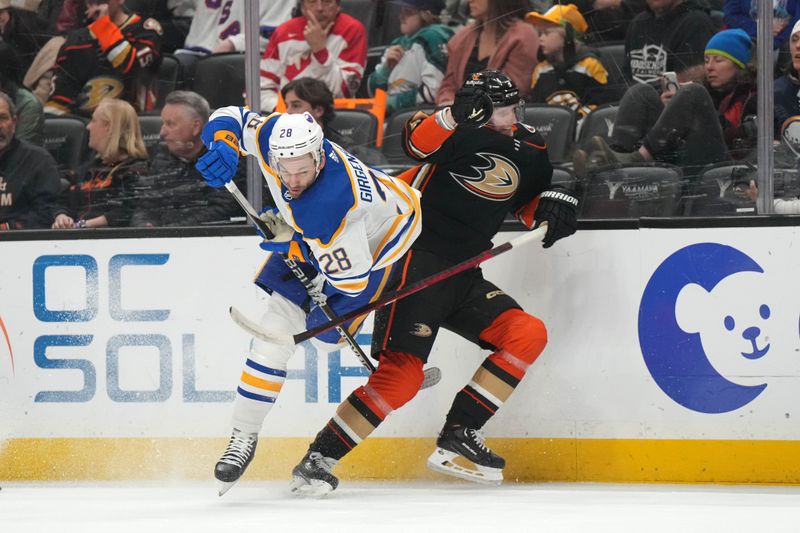 Feb 15, 2023; Anaheim, California, USA; Buffalo Sabres left wing Zemgus Girgensons (28) collides with Anaheim Ducks defenseman John Klingberg (3) in the first period  at Honda Center. Mandatory Credit: Kirby Lee-USA TODAY Sports