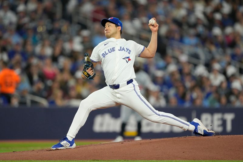 May 10, 2024; Toronto, Ontario, CAN; Toronto Blue Jays starting pitcher Yusei Kikuchi (16) pitches to the Minnesota Twins during the first inning at Rogers Centre. Mandatory Credit: John E. Sokolowski-USA TODAY Sports