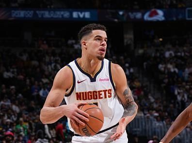 DENVER, CO - DECEMBER 25: Michael Porter Jr. #1 of the Denver Nuggets handles the ball during the game against the Golden State Warriors on December 25, 2023 at the Ball Arena in Denver, Colorado. NOTE TO USER: User expressly acknowledges and agrees that, by downloading and/or using this Photograph, user is consenting to the terms and conditions of the Getty Images License Agreement. Mandatory Copyright Notice: Copyright 2023 NBAE (Photo by Garrett Ellwood/NBAE via Getty Images)