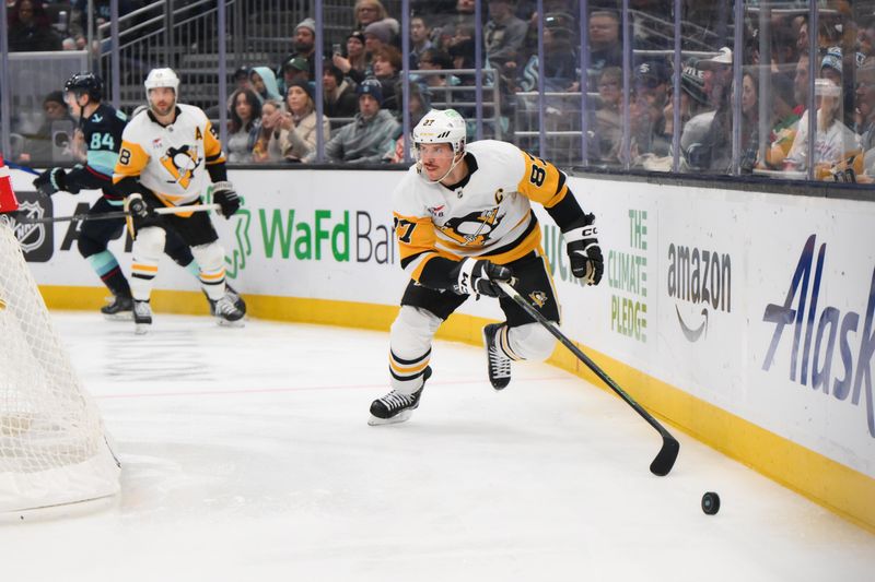 Jan 25, 2025; Seattle, Washington, USA; Pittsburgh Penguins center Sidney Crosby (87) plays the puck during the third period against the Seattle Kraken at Climate Pledge Arena. Mandatory Credit: Steven Bisig-Imagn Images