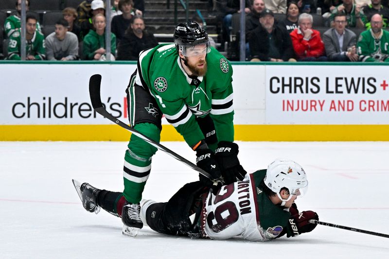 Nov 14, 2023; Dallas, Texas, USA; Dallas Stars defenseman Jani Hakanpaa (2) checks Arizona Coyotes center Barrett Hayton (29) during the third period at the American Airlines Center. Mandatory Credit: Jerome Miron-USA TODAY Sports