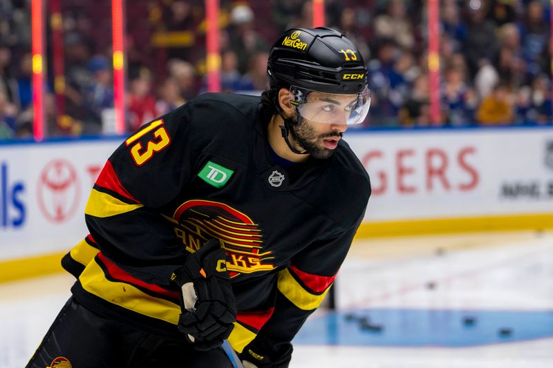 Oct 30, 2024; Vancouver, British Columbia, CAN; Vancouver Canucks forward Arshdeep Bains (13) skates during warm up prior to a game against the New Jersey Devils at Rogers Arena. Mandatory Credit: Bob Frid-Imagn Images