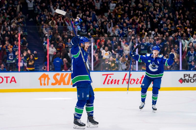 Jan 24, 2024; Vancouver, British Columbia, CAN; Vancouver Canucks forward Pius Suter (24) and forward Elias Pettersson (40) celebrate Suter   s third goal of the game against the St. Louis Blues in the third period at Rogers Arena. Blues 4-3 in overtime. Mandatory Credit: Bob Frid-USA TODAY Sports