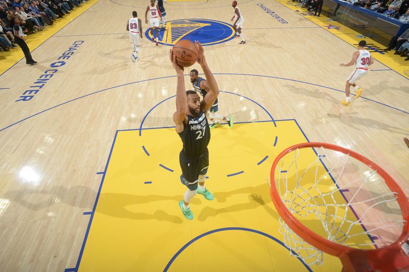 SAN FRANCISCO, CA - DECEMBER 8:  Rudy Gobert #27 of the Minnesota Timberwolves grabs the rebound during the game against the Golden State Warriors during a regular season game on December 8, 2024 at Chase Center in San Francisco, California. NOTE TO USER: User expressly acknowledges and agrees that, by downloading and or using this photograph, user is consenting to the terms and conditions of Getty Images License Agreement. Mandatory Copyright Notice: Copyright 2024 NBAE (Photo by Noah Graham/NBAE via Getty Images)