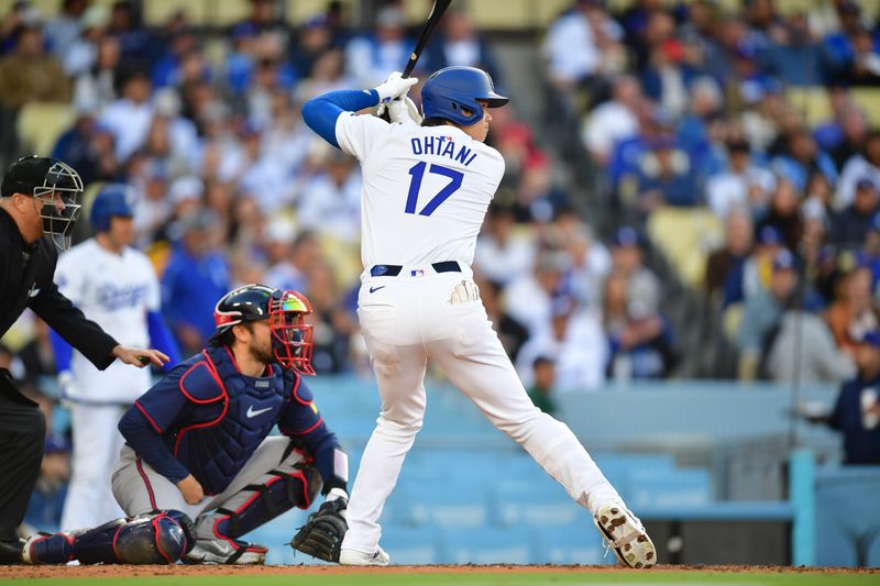 May 4, 2024; Los Angeles, California, USA; Los Angeles Dodgers designated hitter Shohei Ohtani (17) hits against the Atlanta Braves during the third inning at Dodger Stadium. Mandatory Credit: Gary A. Vasquez-USA TODAY Sports