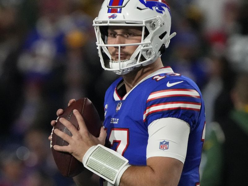 Buffalo Bills quarterback Josh Allen (17) warms up before an NFL football game against the Green Bay Packers, Sunday, Oct. 30, 2022, in Buffalo, New York. (AP Photo/Rick Scuteri)