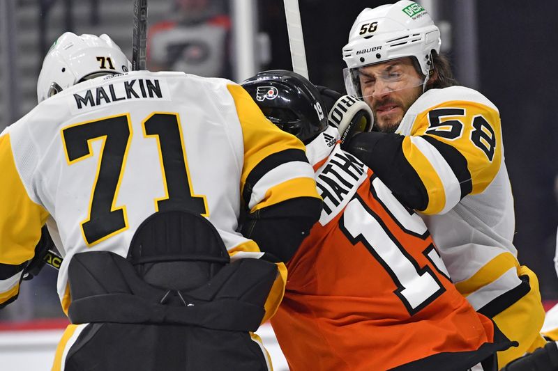 Jan 8, 2024; Philadelphia, Pennsylvania, USA; Philadelphia Flyers right wing Garnet Hathaway (19) battles with Pittsburgh Penguins center Evgeni Malkin (71) and  defenseman Kris Letang (58) during the third period at Wells Fargo Center. Mandatory Credit: Eric Hartline-USA TODAY Sports