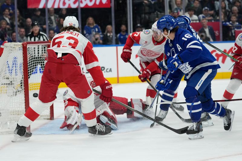 Nov 8, 2024; Toronto, Ontario, CAN; Toronto Maple Leafs forward Mitch Marner (16) scores against Detroit Red Wings goaltender Cam Talbot (39) during the first period at Scotiabank Arena. Mandatory Credit: John E. Sokolowski-Imagn Images