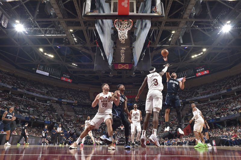 CLEVELAND, OH - APRIL 22: Jalen Suggs #4 of the Orlando Magic shoots the ball during the game against the Cleveland Cavaliers during Round 1 Game 2 of the 2024 NBA Playoffs on April 22, 2024 at Rocket Mortgage FieldHouse in Cleveland, Ohio. NOTE TO USER: User expressly acknowledges and agrees that, by downloading and/or using this Photograph, user is consenting to the terms and conditions of the Getty Images License Agreement. Mandatory Copyright Notice: Copyright 2024 NBAE (Photo by David Liam Kyle/NBAE via Getty Images)