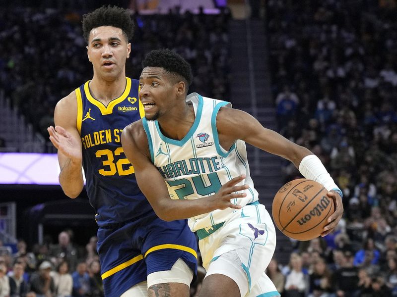 SAN FRANCISCO, CALIFORNIA - FEBRUARY 23: Brandon Miller #24 of the Charlotte Hornets drives to the basket on Trayce Jackson-Davis #32 of the Golden State Warriors during the fourth quarter of an NBA basketball game at Chase Center on February 23, 2024 in San Francisco, California. NOTE TO USER: User expressly acknowledges and agrees that, by downloading and or using this photograph, User is consenting to the terms and conditions of the Getty Images License Agreement. (Photo by Thearon W. Henderson/Getty Images)