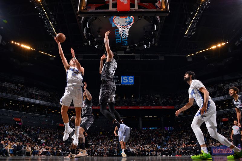 BROOKLYN, NY - DECEMBER 1: Franz Wagner #22 of the Orlando Magic drives to the basket during the game against the Brooklyn Nets on December 1, 2024 at Barclays Center in Brooklyn, New York. NOTE TO USER: User expressly acknowledges and agrees that, by downloading and or using this Photograph, user is consenting to the terms and conditions of the Getty Images License Agreement. Mandatory Copyright Notice: Copyright 2024 NBAE (Photo by Jesse D. Garrabrant/NBAE via Getty Images)