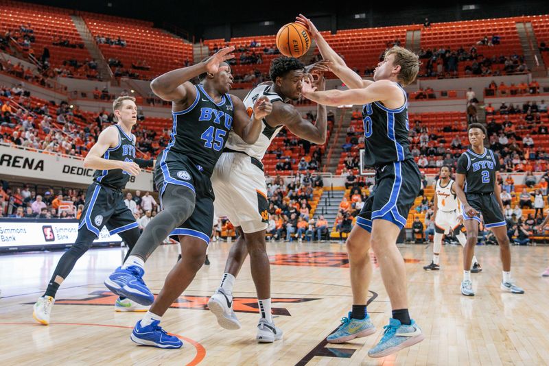 Feb 17, 2024; Stillwater, Oklahoma, USA; Oklahoma State Cowboys forward Eric Dailey Jr. (2) gets tangled up with Brigham Young Cougars forward Fousseyni Traore (45) and Brigham Young Cougars guard Dallin Hall (30) going after a rebound during the first half at Gallagher-Iba Arena. Mandatory Credit: William Purnell-USA TODAY Sports